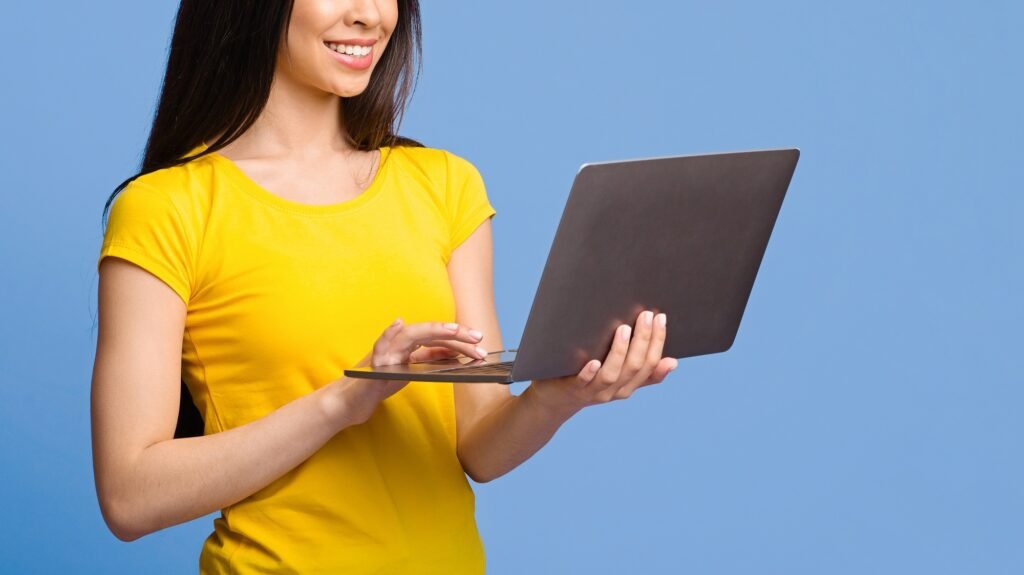 Online Job Opportunities. Smiling Woman Browsing Recruiting Website On Laptop Computer